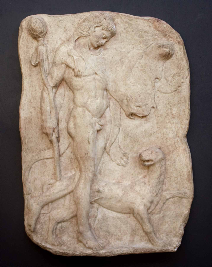 photo of yellow-colored plaster cast relief sculpture of satyr with animal skin over his arm and staff in one hand walking beside a panther against gray background