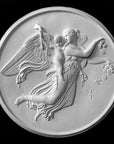 photo of plaster cast relief of female with wings flying and a cherub on her back on black background