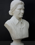 Photo of plaster cast of sculpture bust of Rosa Parks on a black background