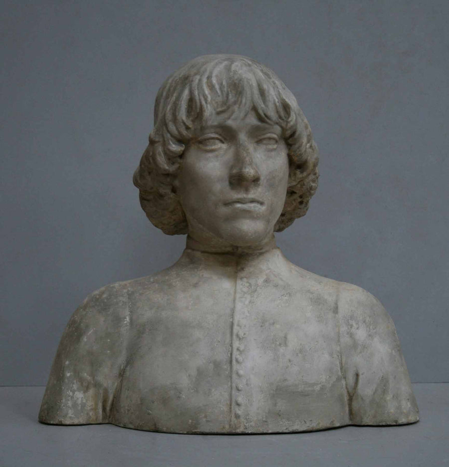photo of plaster cast bust of man with high-neck shirt and shoulder-length hair with gray background