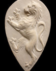 Photo with black background of plaster cast sculpture relief of lion on hind legs