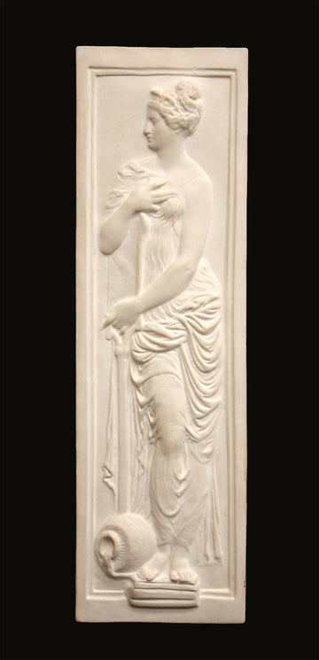 photo of white plaster cast relief sculpture of female figure in drapery