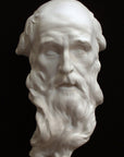 photo with black background of plaster cast of the male face of Saint Andrew with long beard
