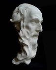 photo with black background of plaster cast of the male face of Saint Andrew with long beard