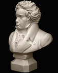 photo of plaster cast sculpture of male bust of Ludwig van Beethoven in dress coat and ruffled necktie on black background
