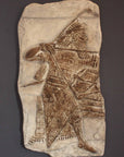 Photo of plaster cast sculpture of ancient sculpture relief on a gray background