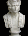 photo of plaster cast sculpture bust of man, namely Christopher Columbus, in robes and hat with black background