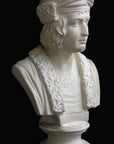 photo of plaster cast sculpture bust of man, namely Christopher Columbus, in robes and hat with black background