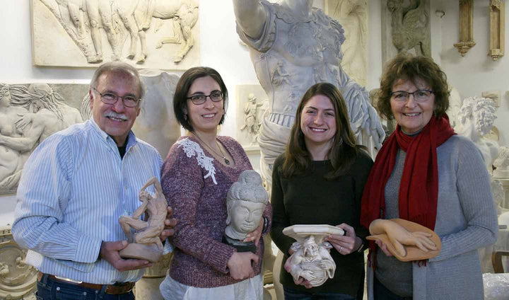 Robert, Lisa, Kayla, and Kathleen in a row in the gallery holding their favorite small casts