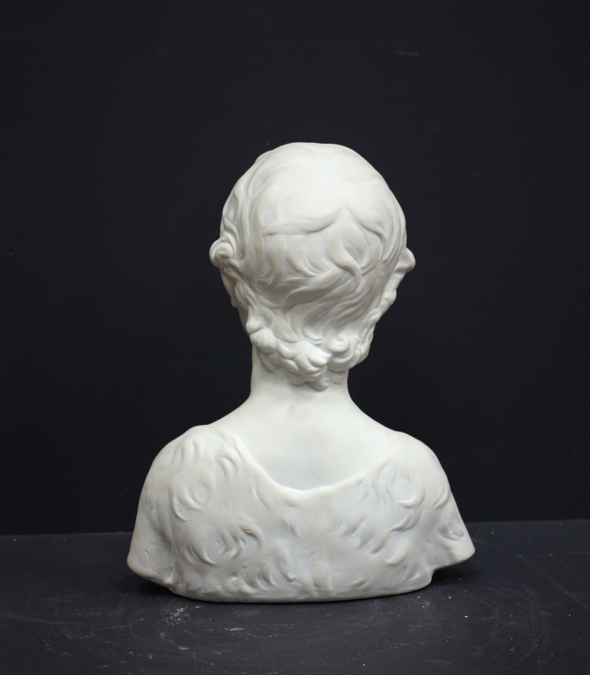 Photo of s sculpture of st john on a grey background 