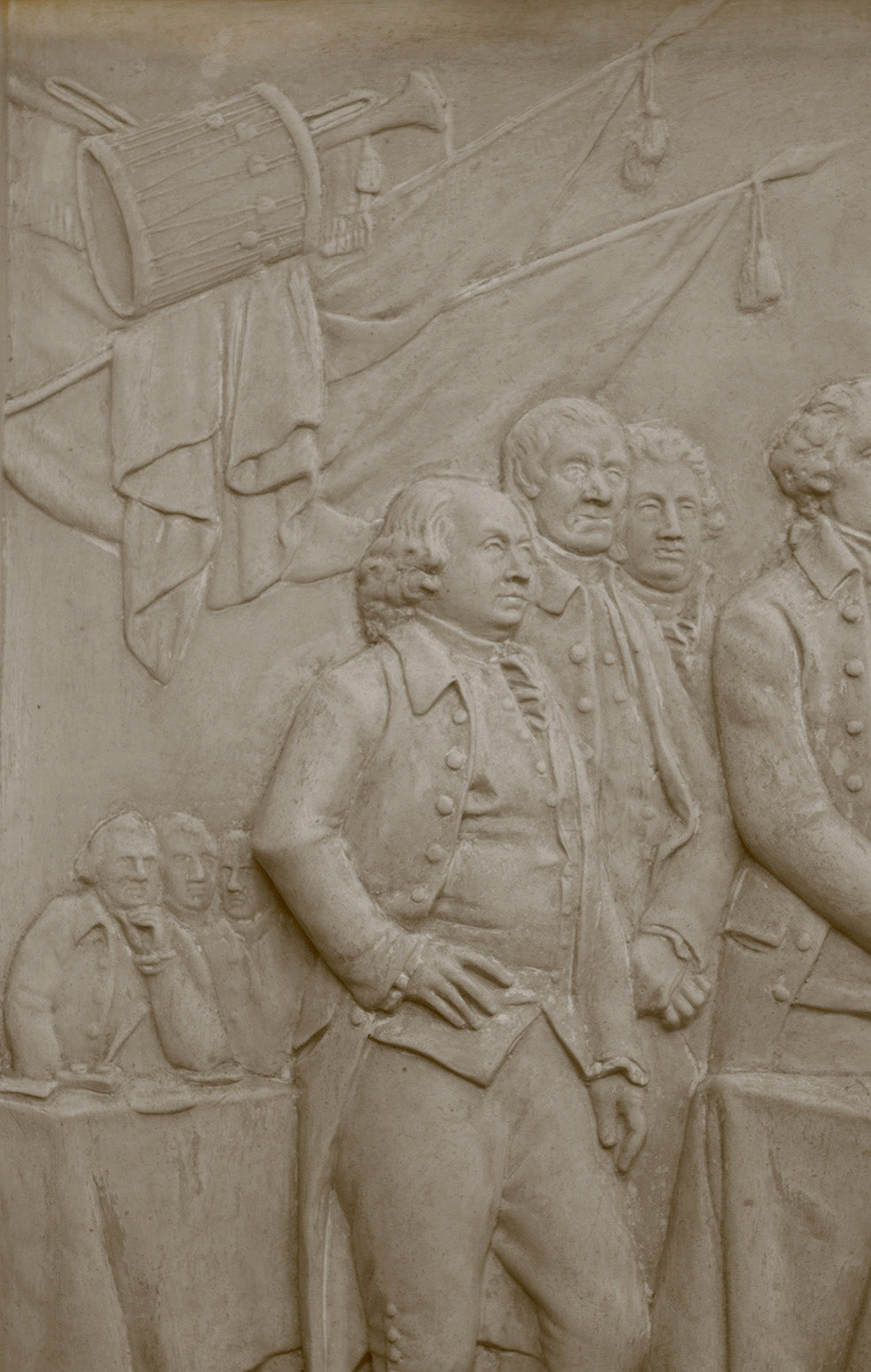 detail photo of off-white plaster cast relief sculpture of men around a table aka signing the Declaration of Independence