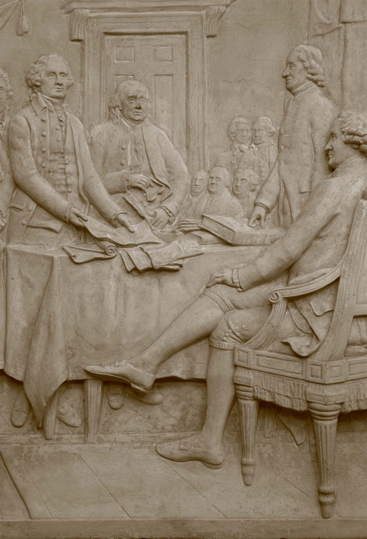 detail photo of off-white plaster cast relief sculpture of men around a table aka signing the Declaration of Independence