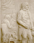 detail photo of off-white plaster cast relief sculpture of four men around a table aka signing the Treaty of Peace and Independence