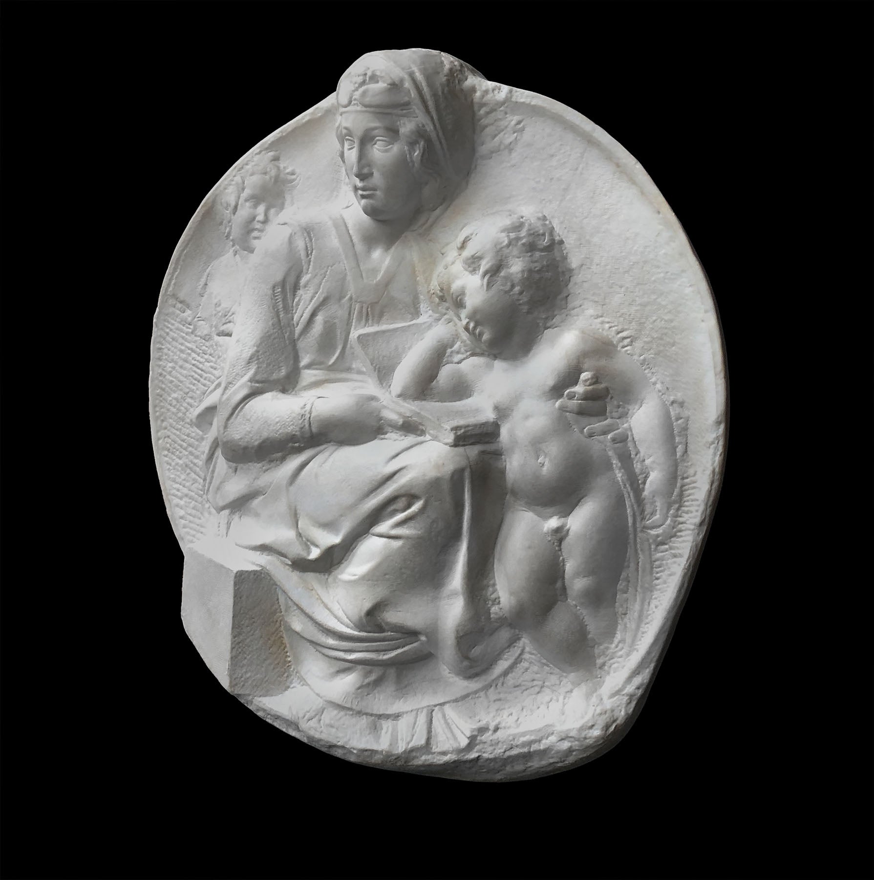 image of a plaster statue of a bust of madonna and child on a black background