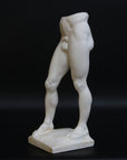 Photo of a decorative sculpture of a man's torso on a black background