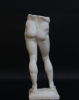 Photo of a decorative sculpture of a man's torso on a black background