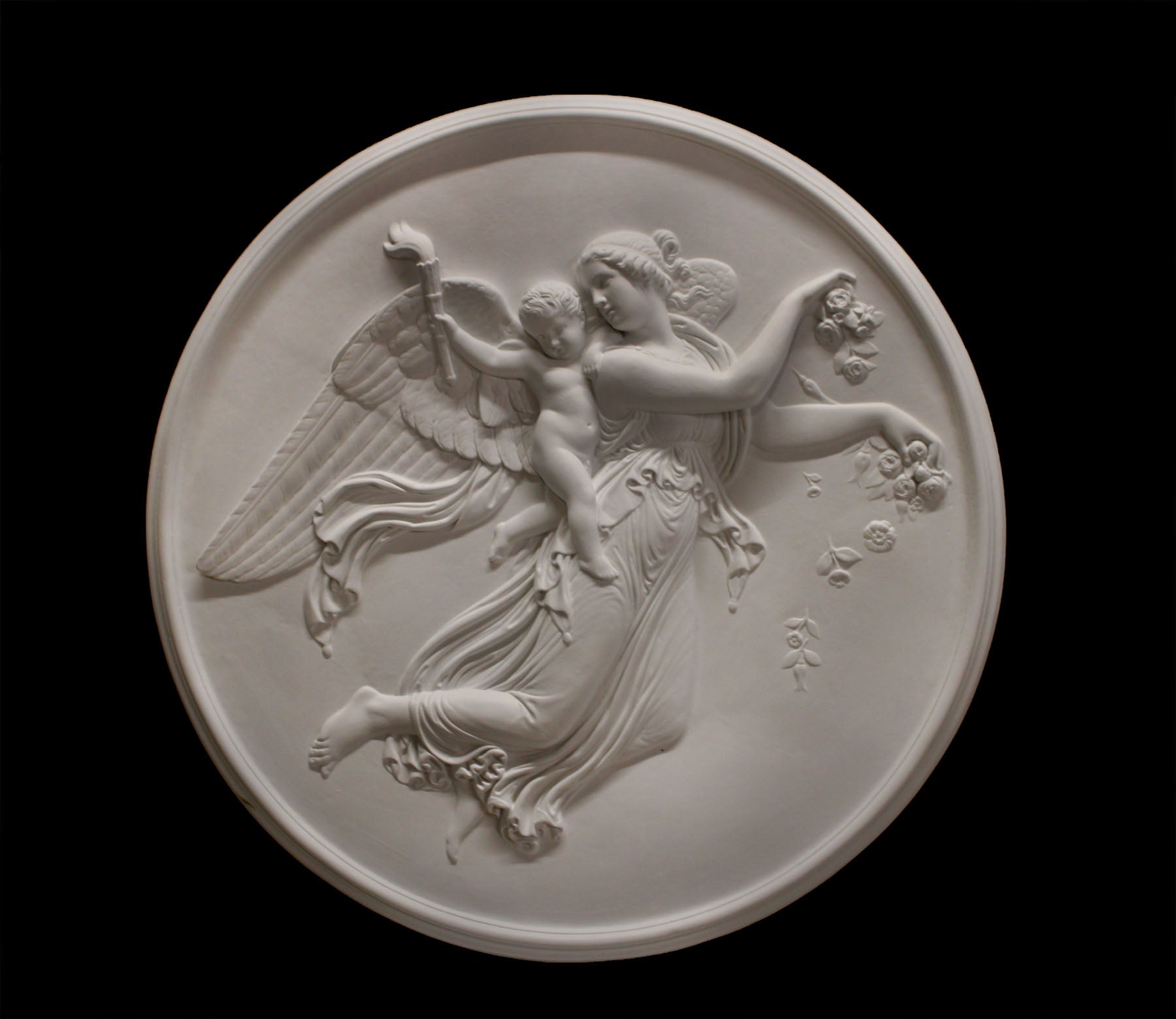  photo of plaster cast relief of female with wings flying and a cherub on her back on black background