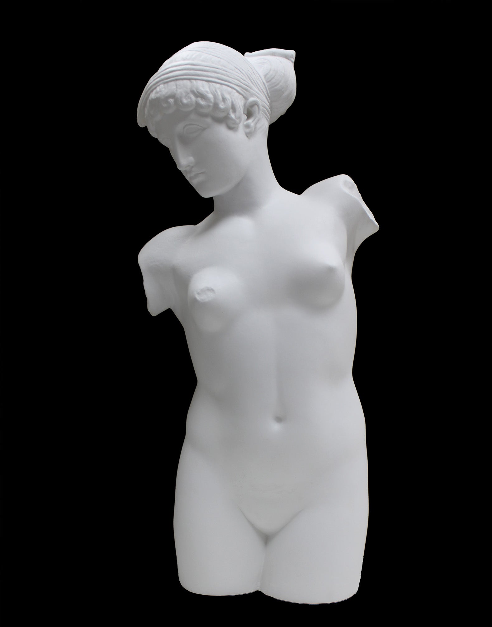Photo of a sculpture of a female torso with a head