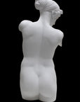Photo of a sculpture of a female torso with a head