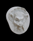 Photo of  a sculpture of a faun on a black background