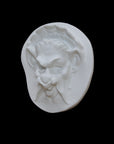 Photo of  a sculpture of a faun on a black background