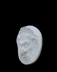 Photo of  a sculpture of a faun on a black background