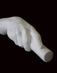 photo of white plaster cast of right hand grasping a staff or pole against black background