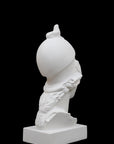 photo of plaster cast sculpture bust of female head, namely the goddess Athena, with a helmet on a black background
