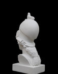 photo of plaster cast sculpture bust of female head, namely the goddess Athena, with a helmet on a black background