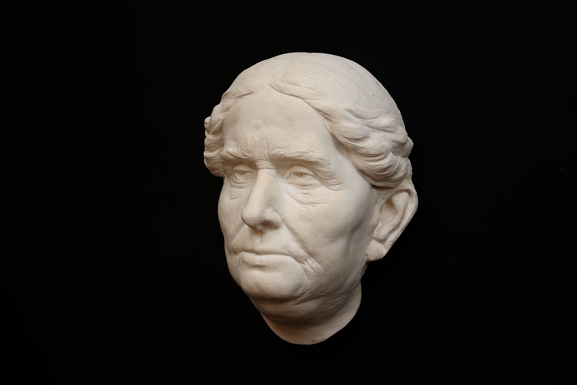 Photo of a portrait of a old lady on a black background