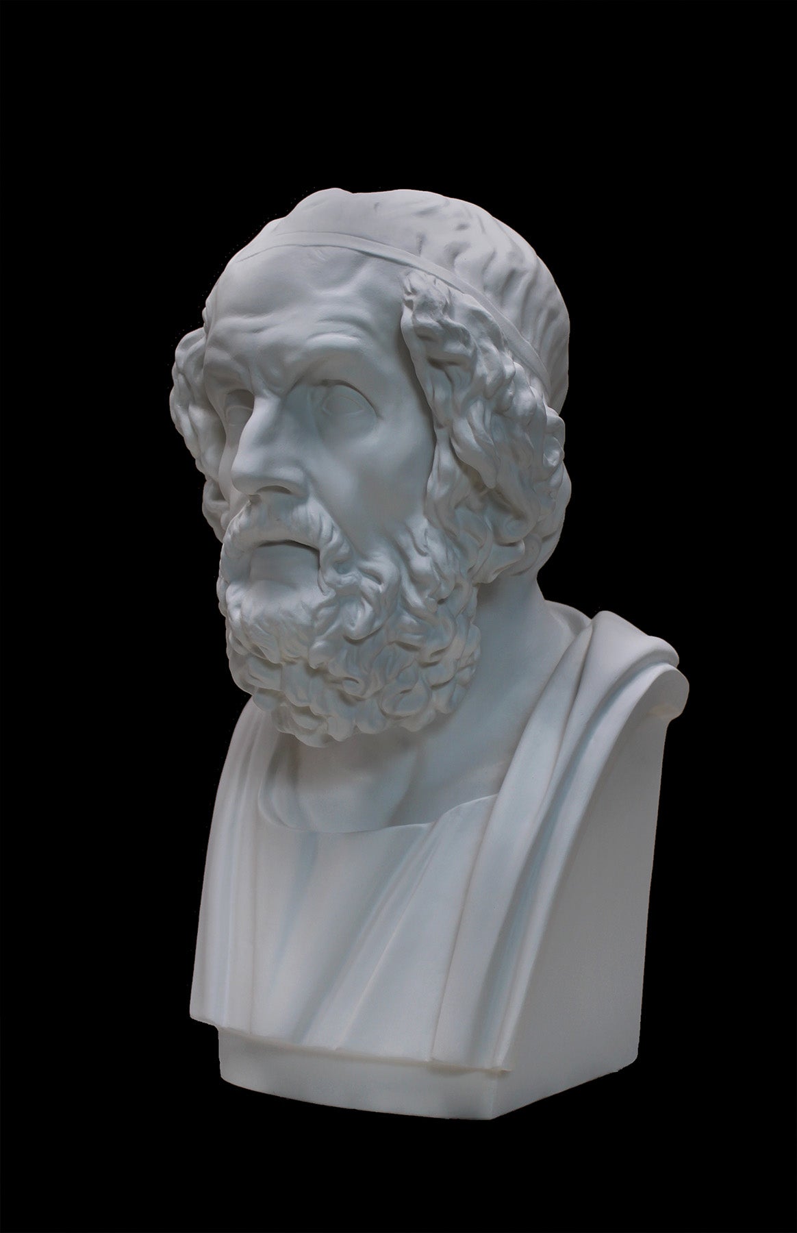image of a plaster statue of a bust of homer on a black background