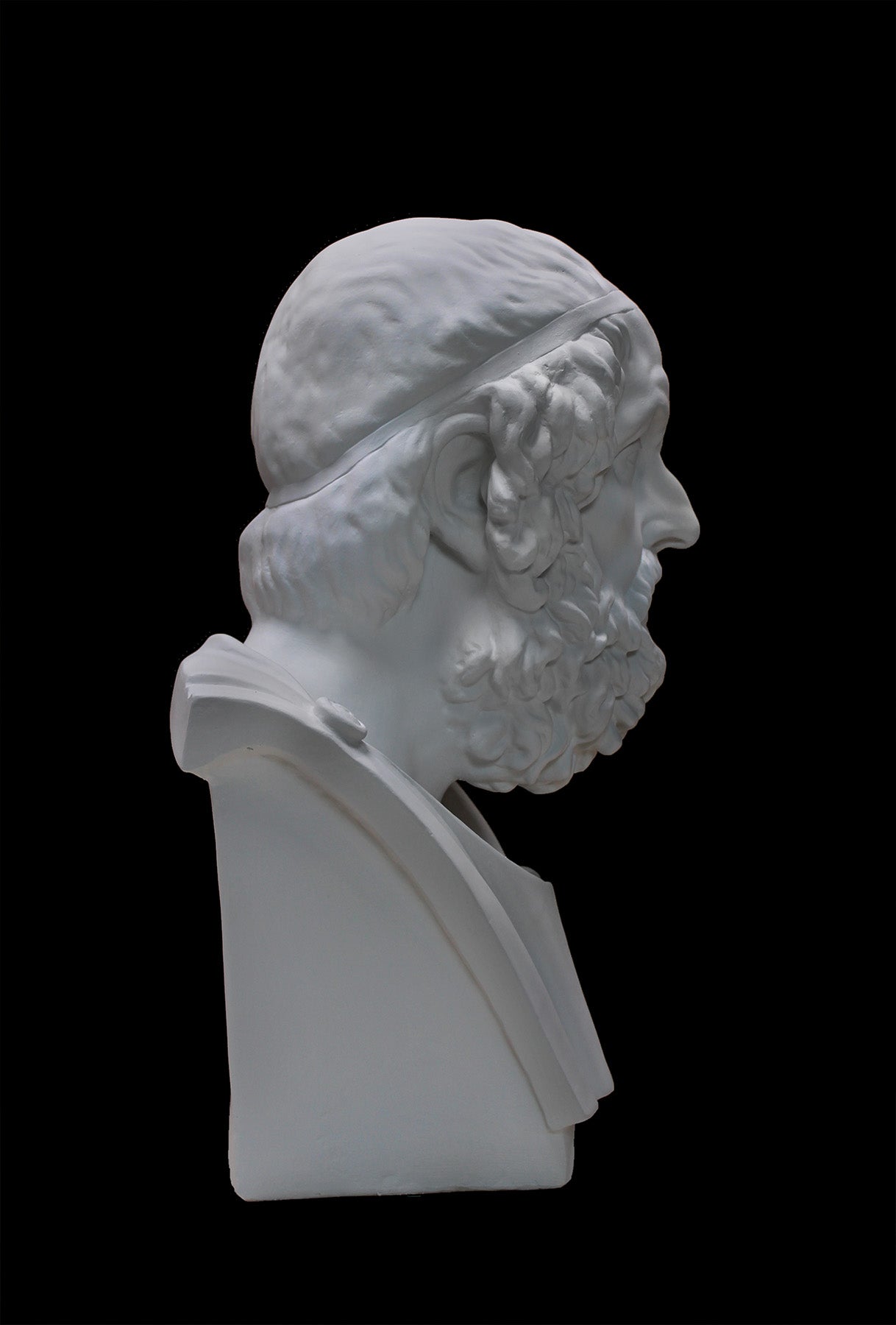image of a plaster bust of homer on a black background