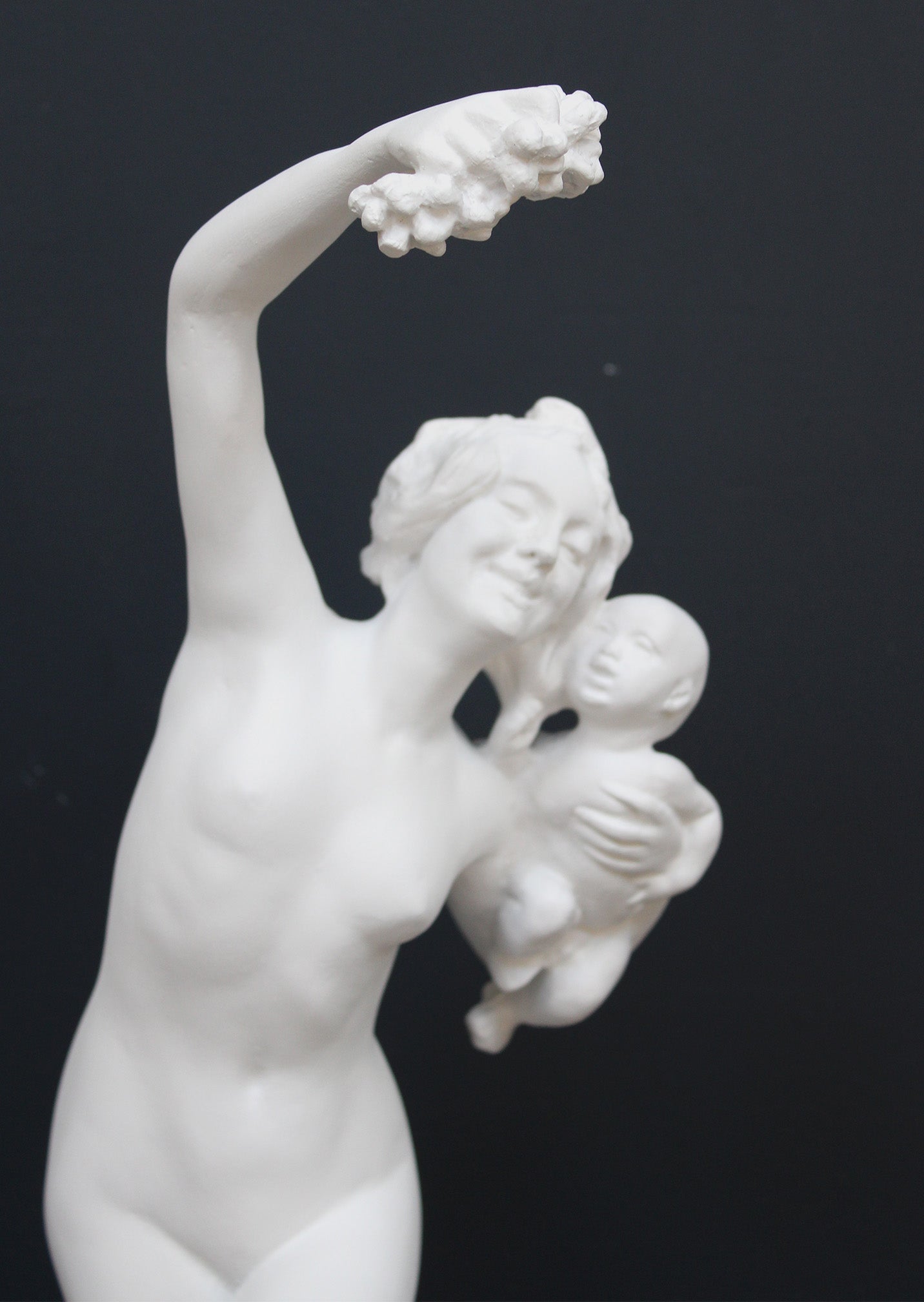 Photo of a dancing lady and baby on a black background