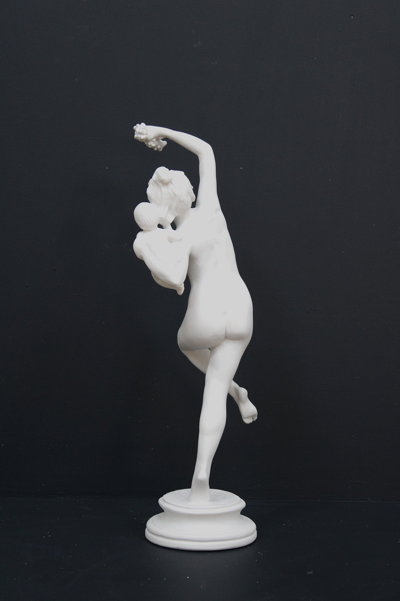 Photo of a dancing lady and baby on a black background