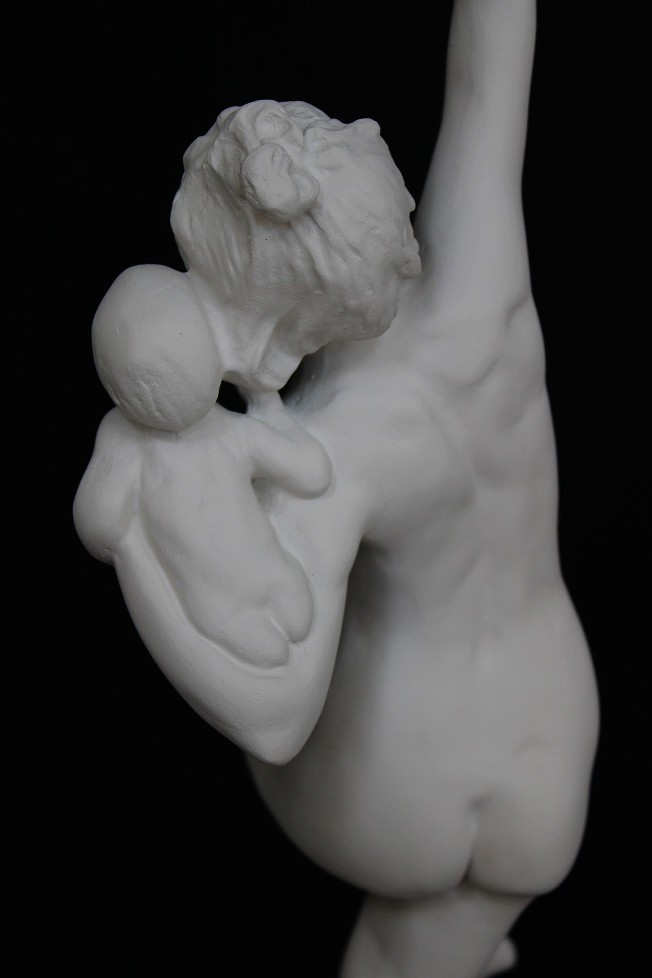 Photo of a dancing lady and baby on a black background