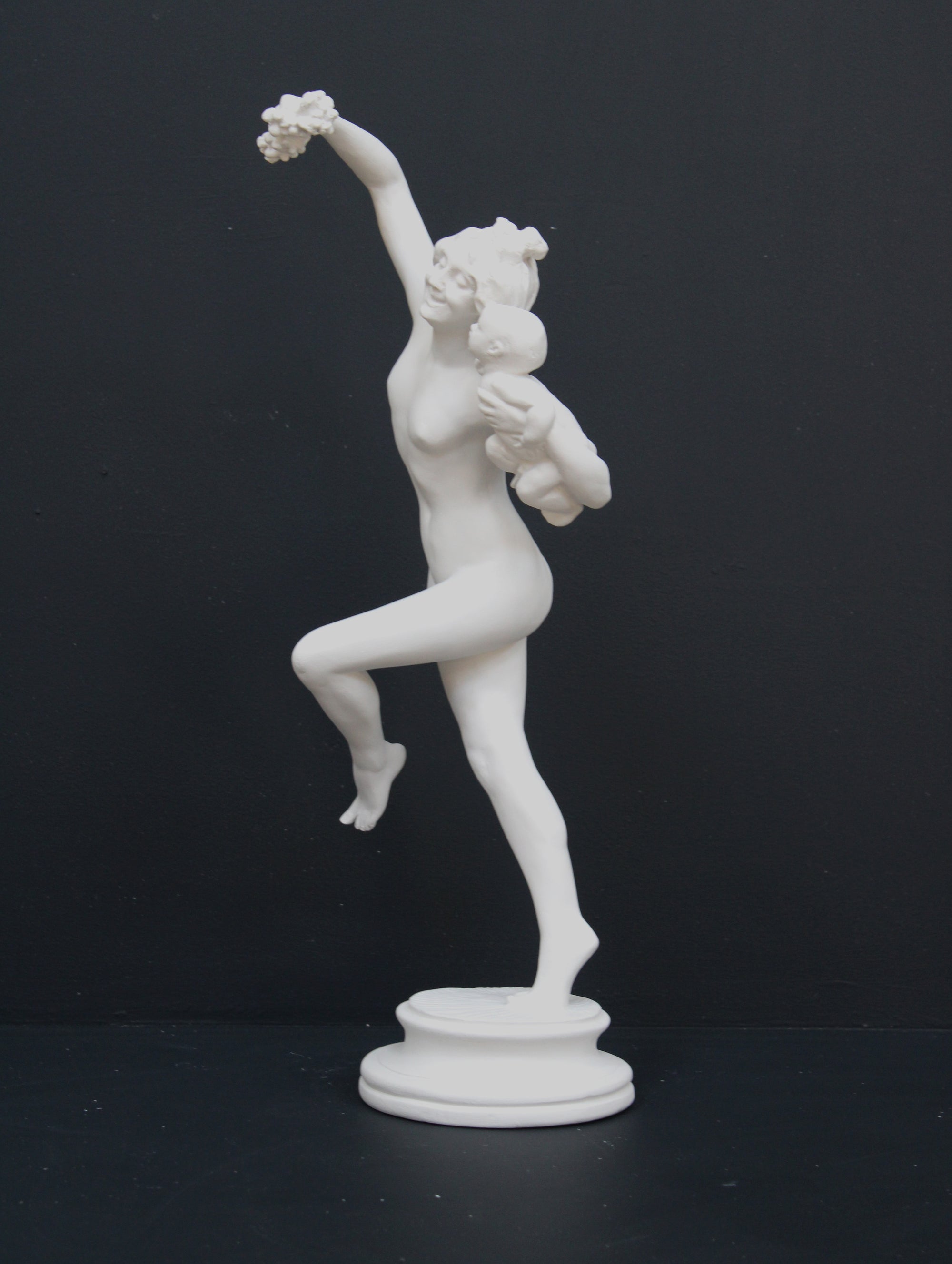 Photo of a dancing lady and baby on a black background