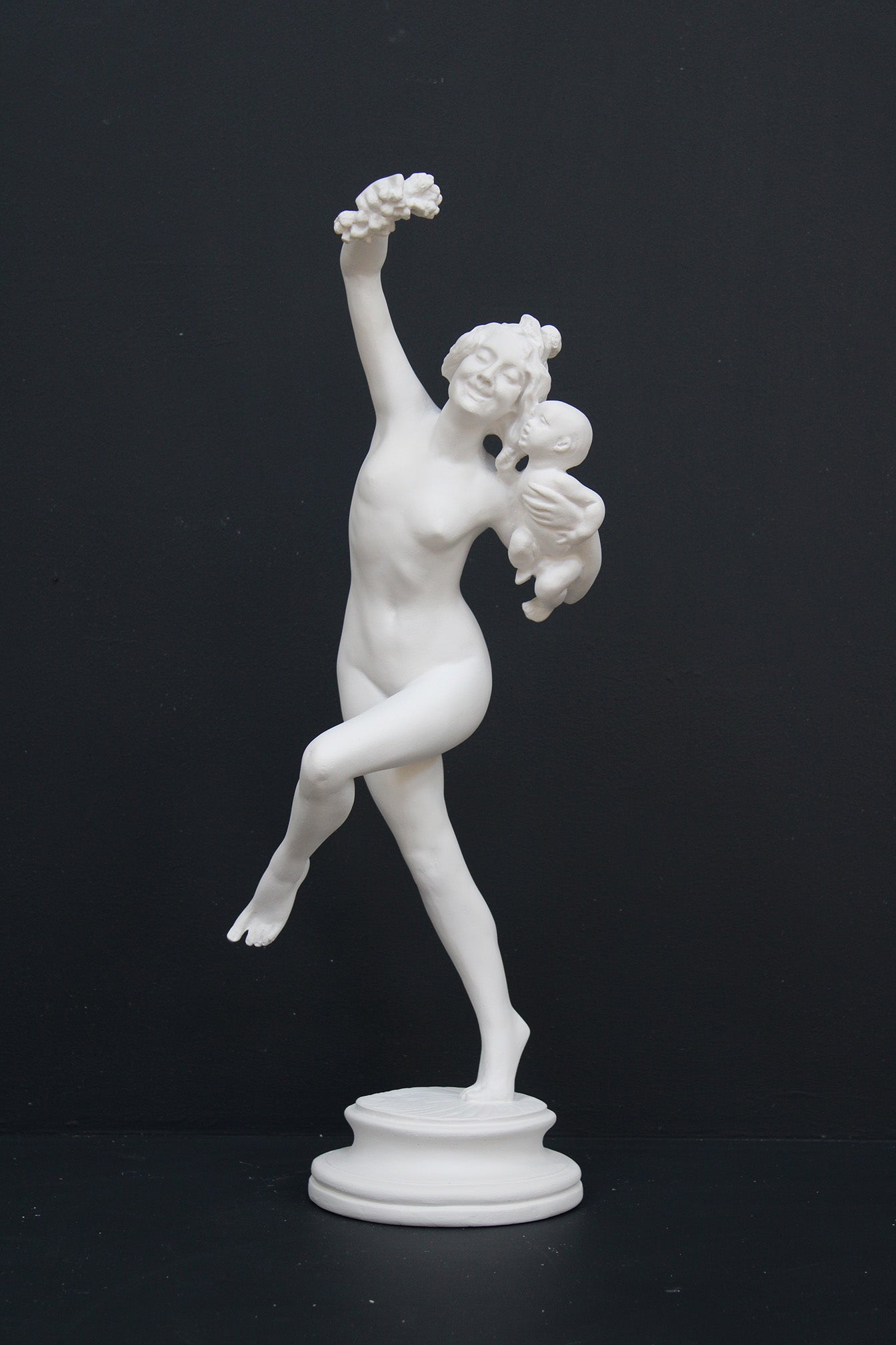 Photo of a dancing lady and baby on a black background
