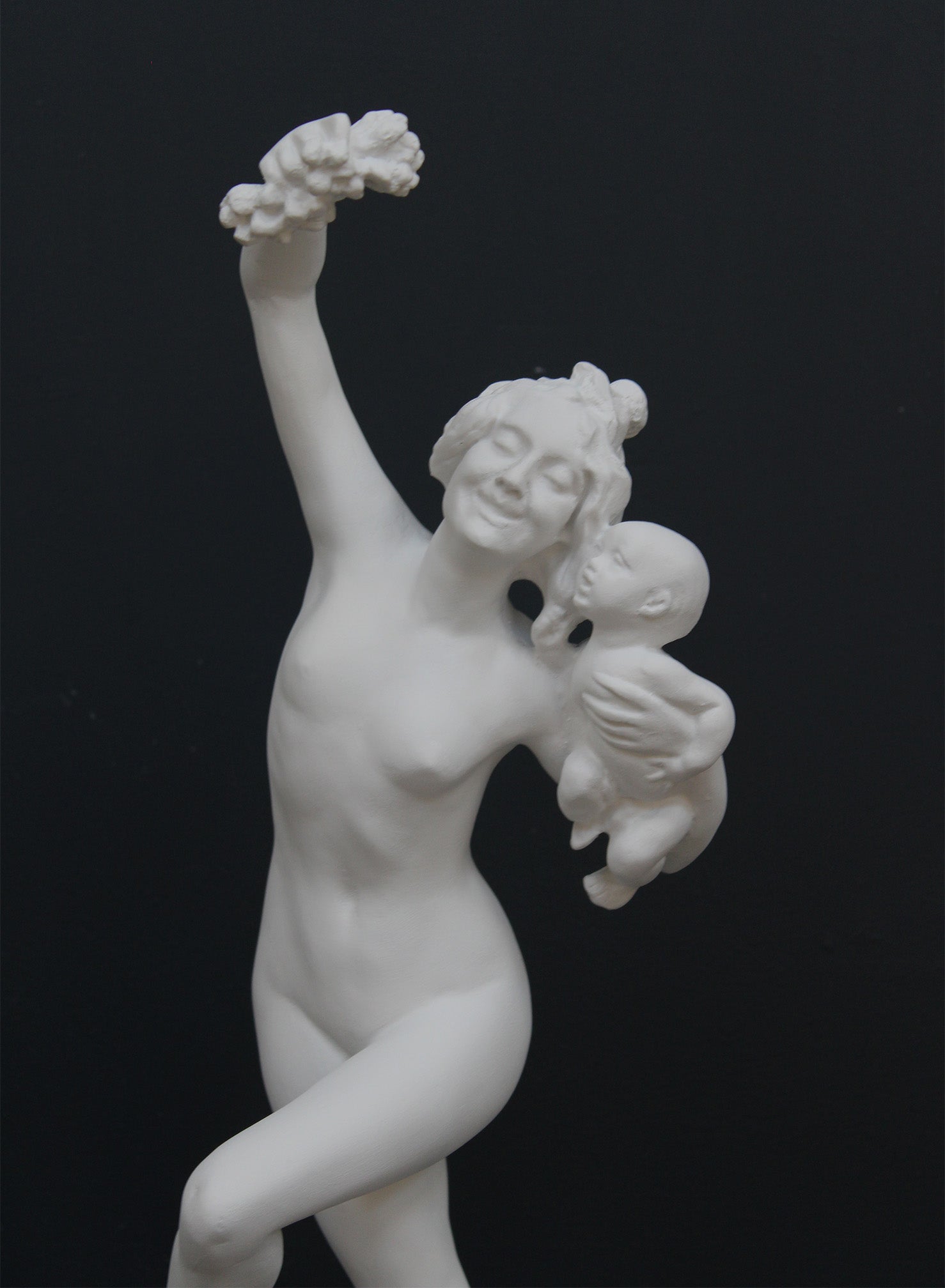 Photo of a dancing lady and baby on a black background