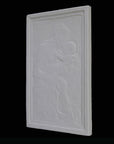 photo detail of plaster cast sculpture relief of the Madonna holding baby Jesus on her lap on black background