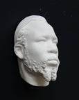 Photo of a sculpture of a Nubian head on a black background