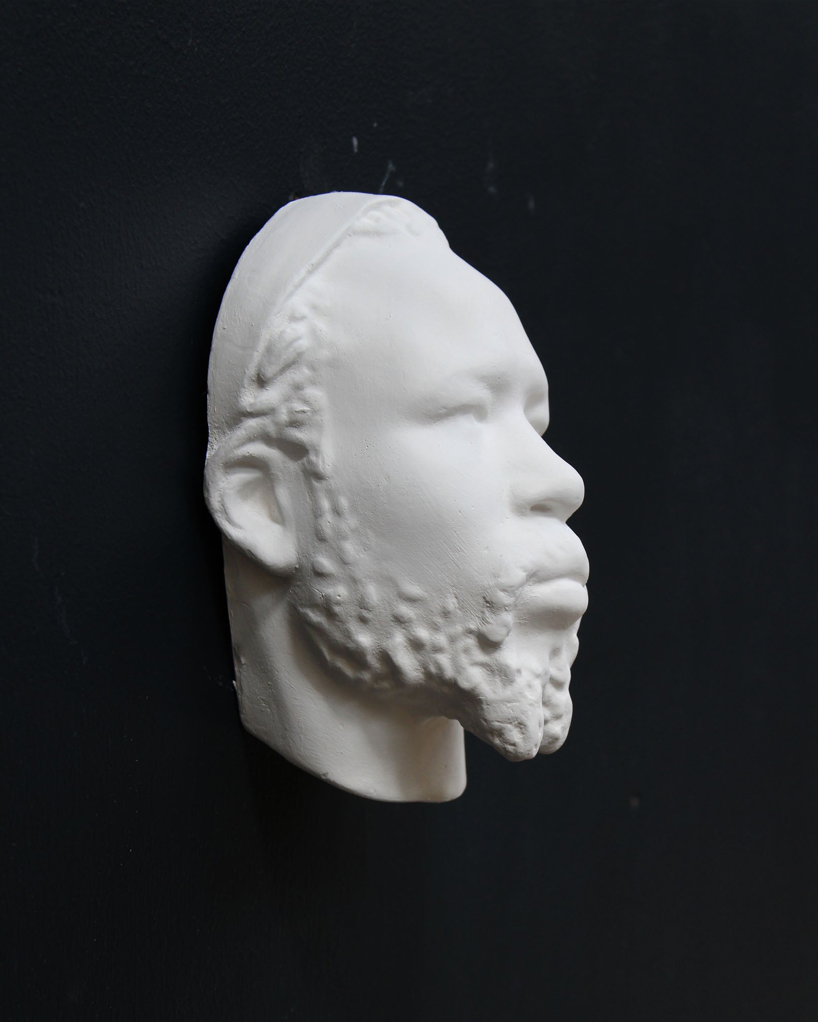 Photo of a sculpture of a Nubian head on a black background