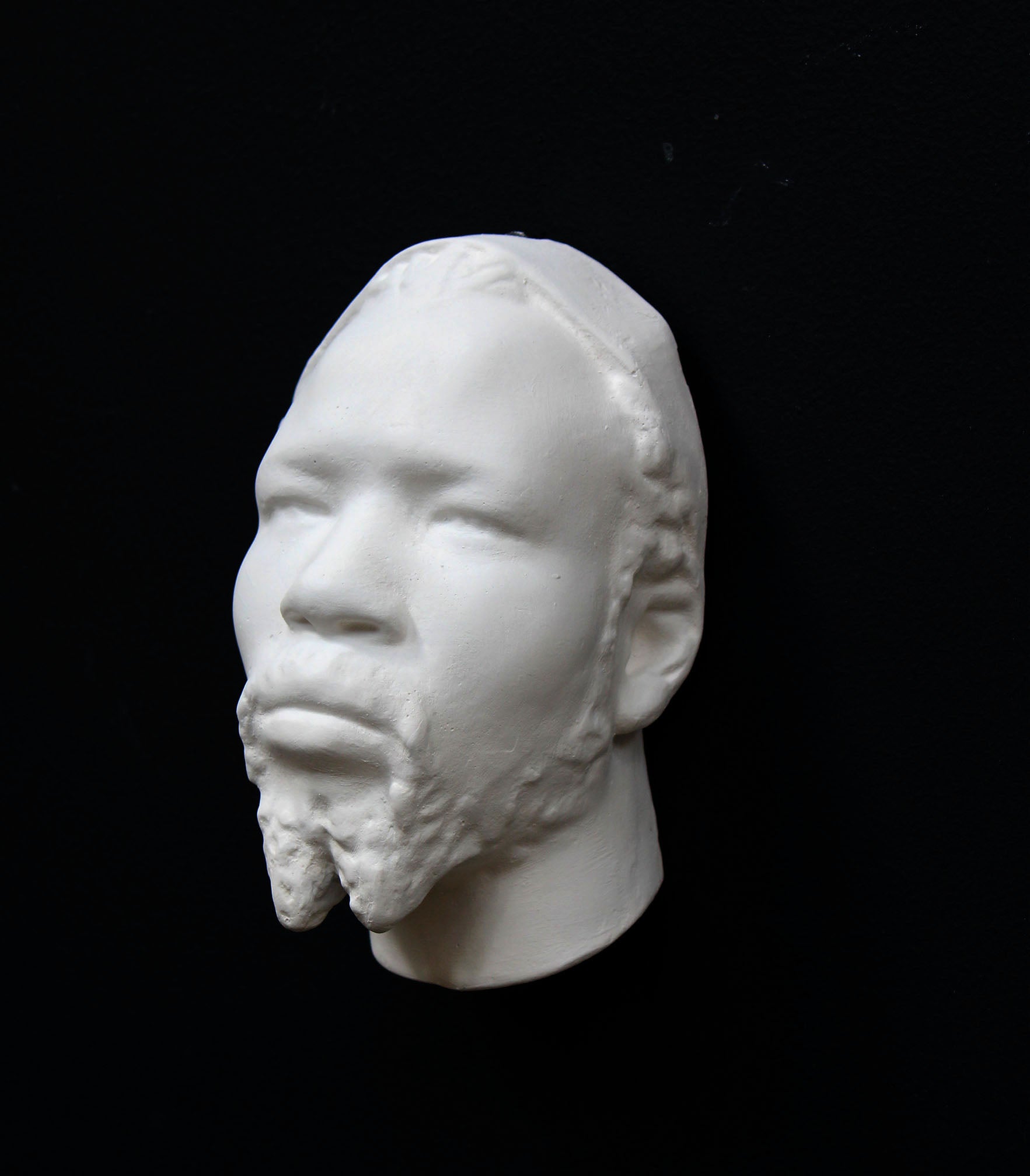 Photo of a sculpture of a Nubian head on a black background