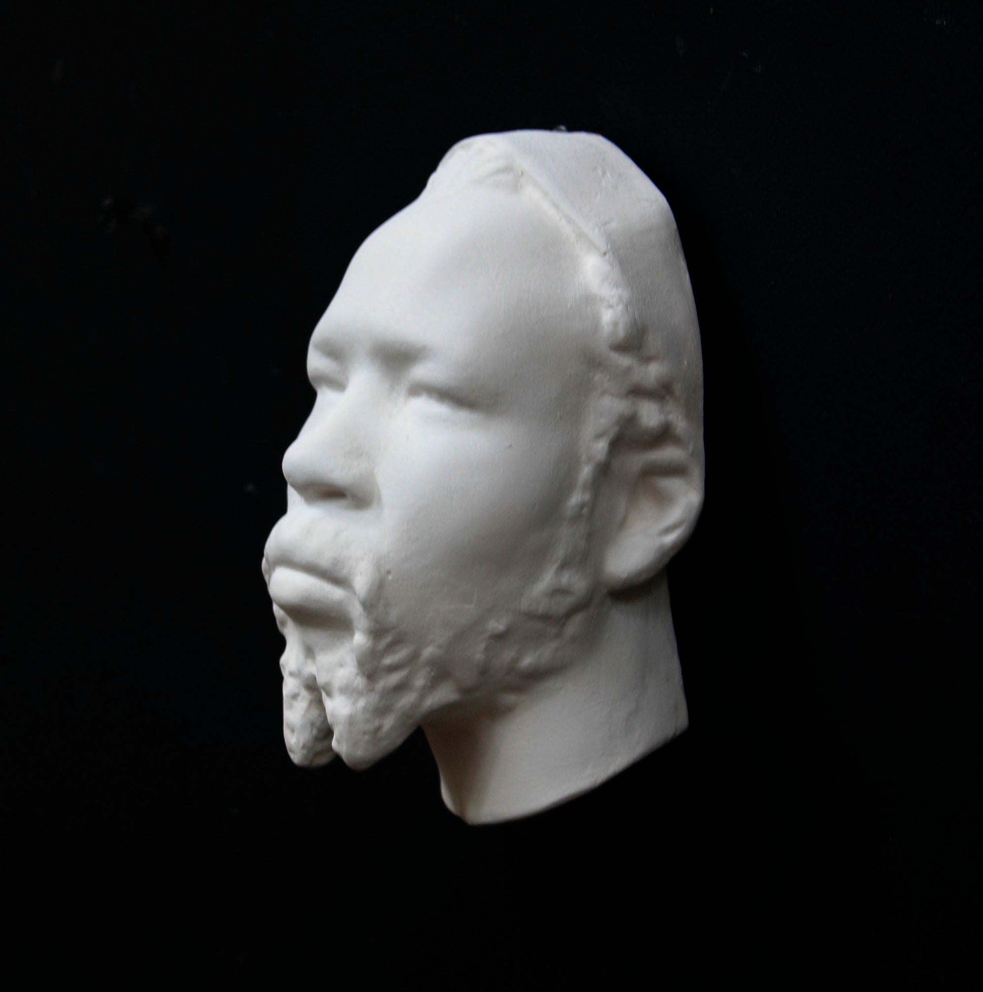 Photo of a sculpture of a Nubian head on a black background