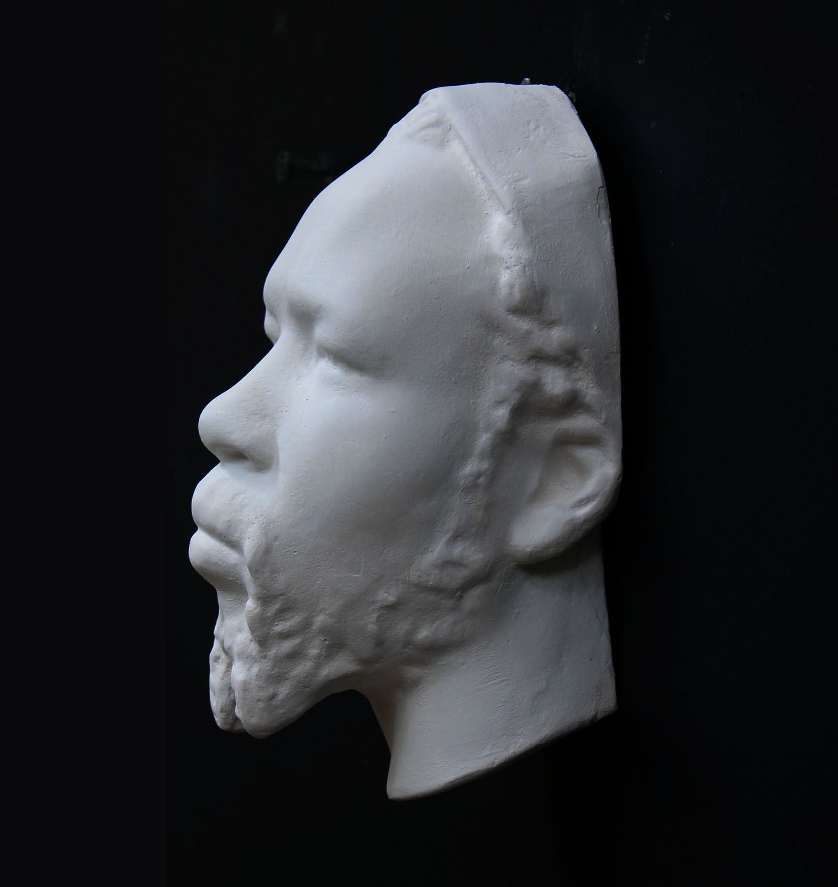 Photo of a sculpture of a Nubian head on a black background