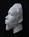 Photo of a sculpture of a Nubian head on a black background