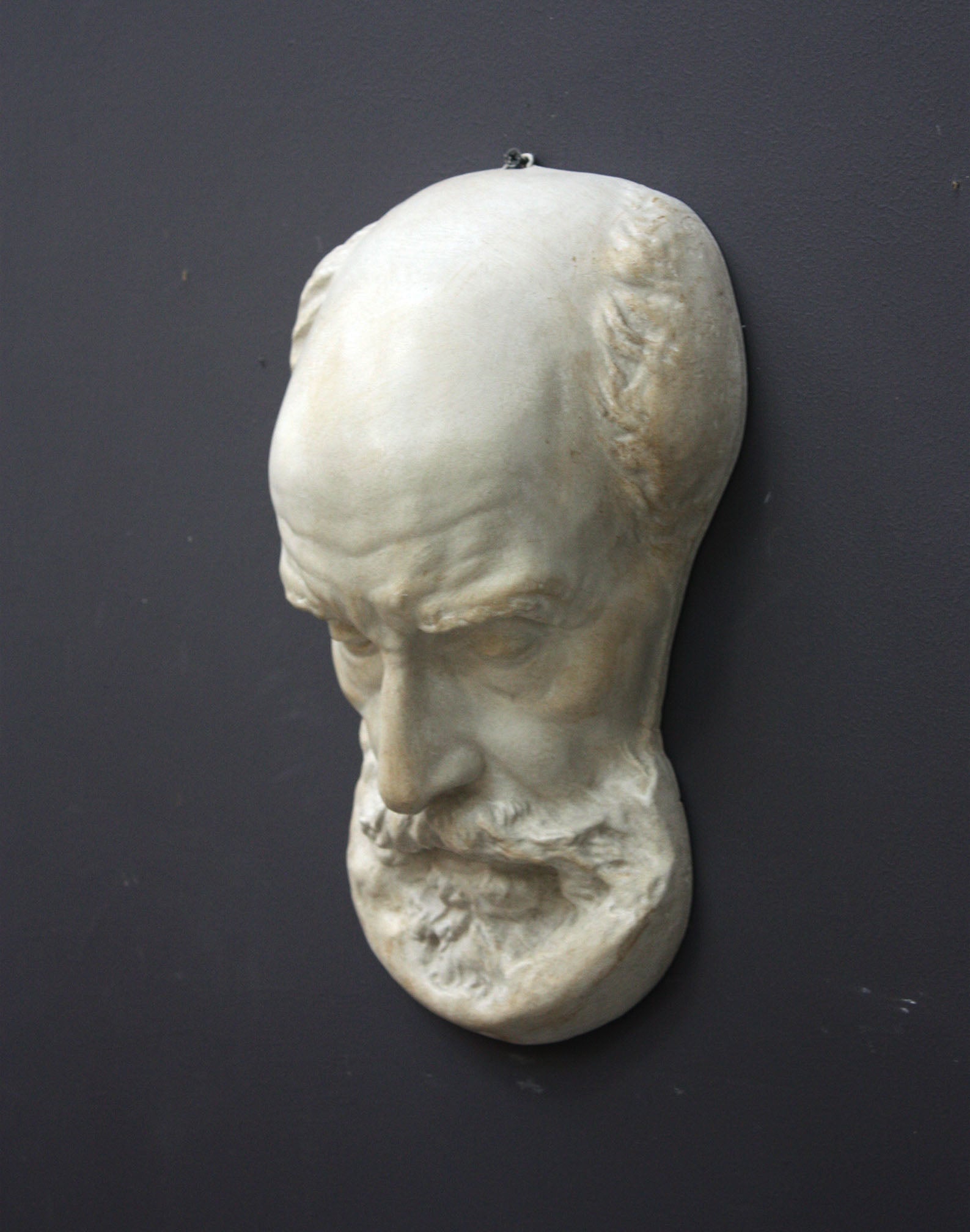 Photo of a sculpture of a St Jermone head on a gray background