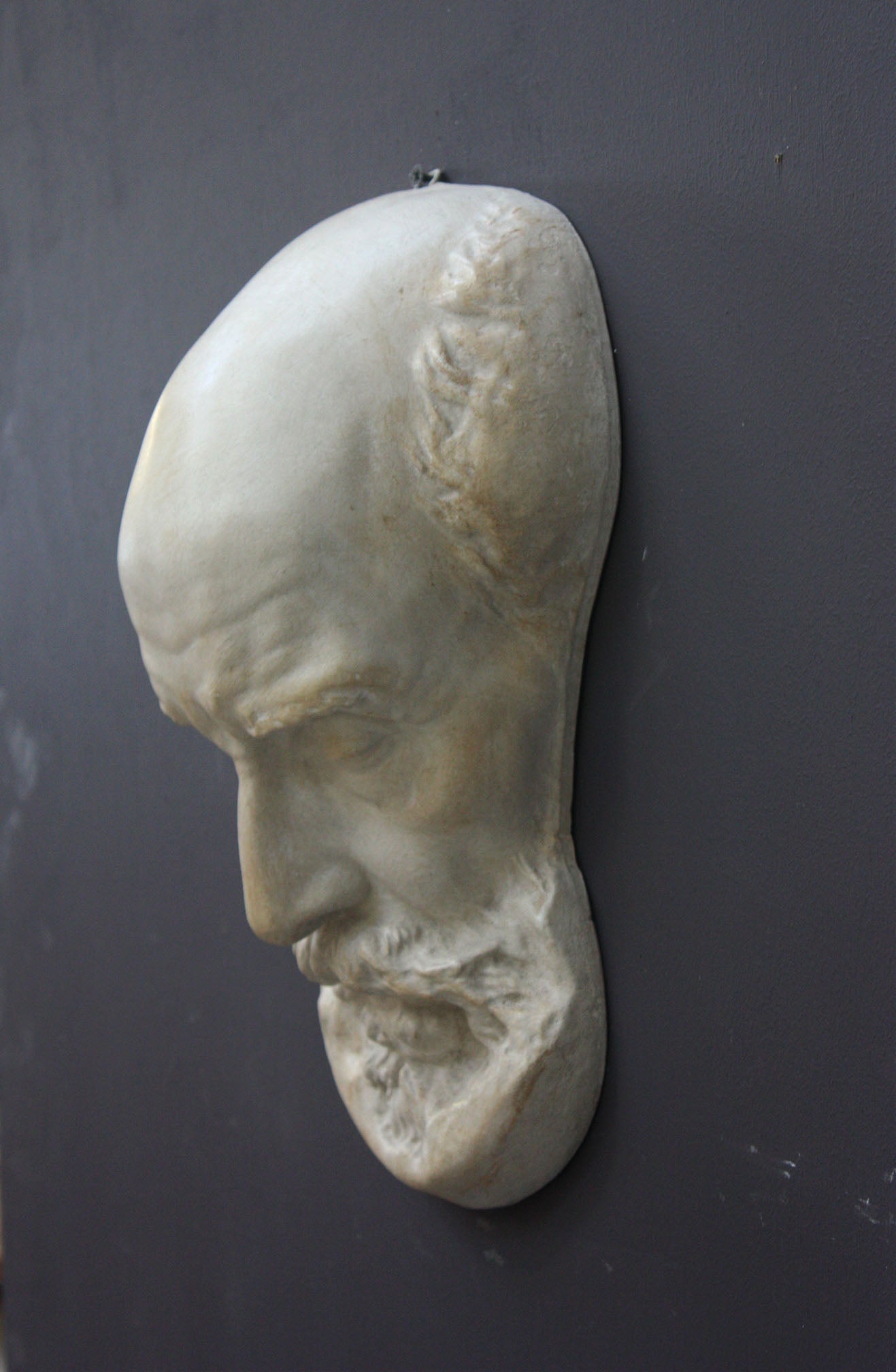 Photo of a sculpture of a St Jermone head on a gray background