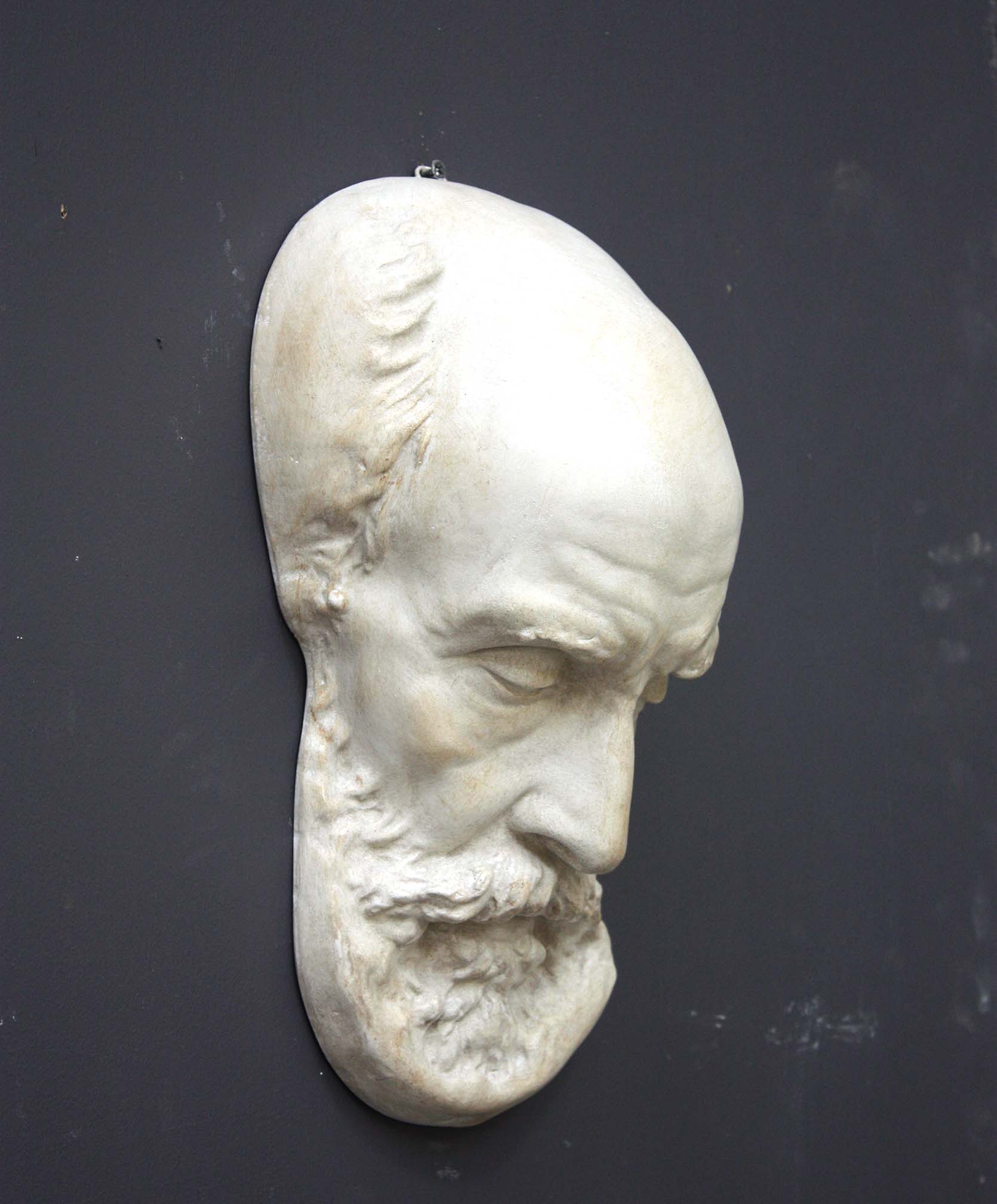 Photo of a sculpture of a St Jermone head on a gray background