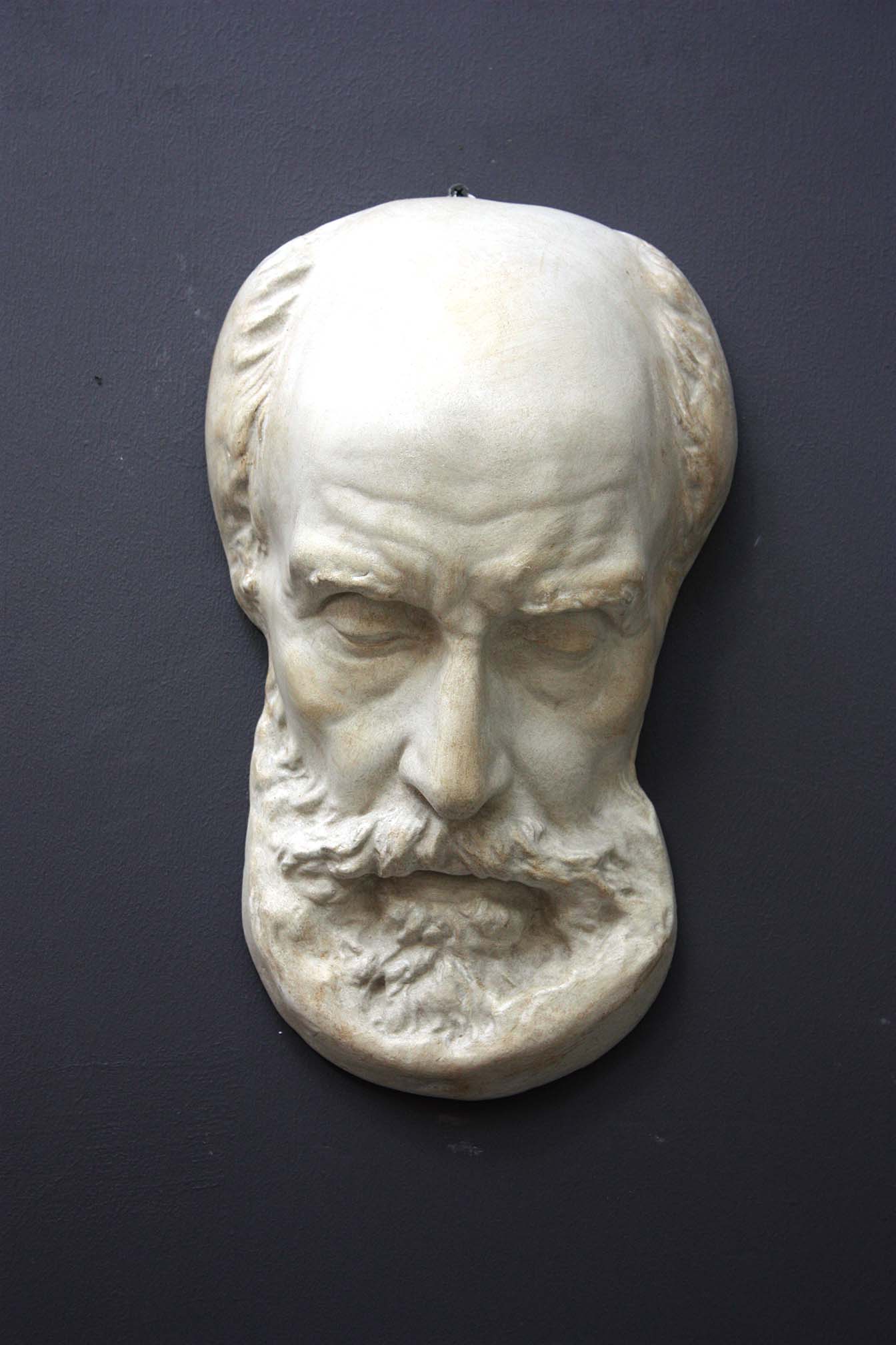 Photo of a sculpture of a St Jermone head on a gray background