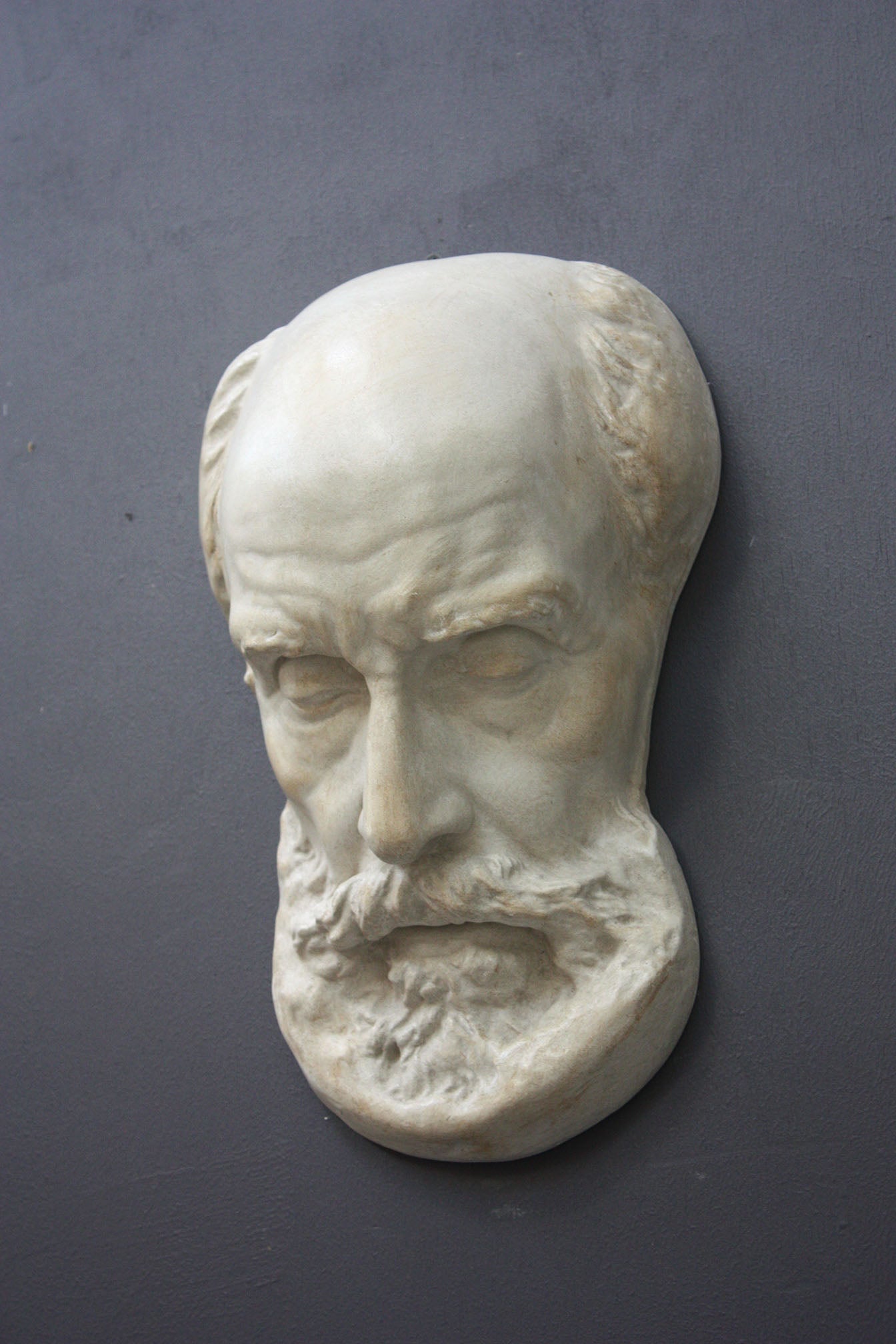 Photo of a sculpture of a St Jermone head on a gray background
